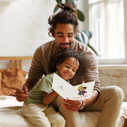 Man and child sitting together holding a birthday card in a cozy room.