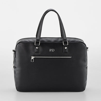 Black leather briefcase with 'PD' initials on a light gray background