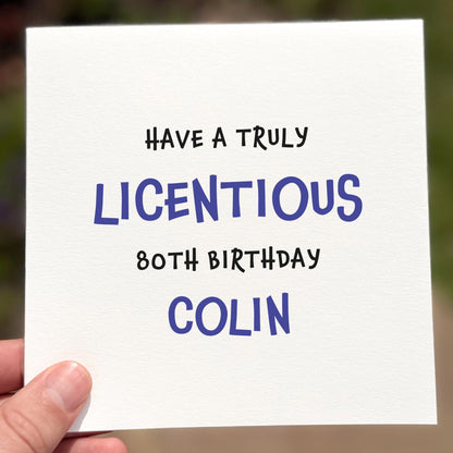 Hand holding a card with humorous birthday message for Colin