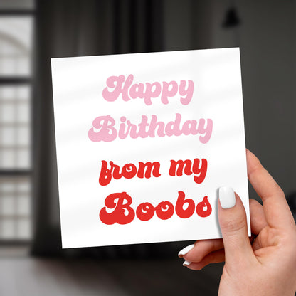 Hand holding a card with 'Happy Birthday from my Boobs' text.