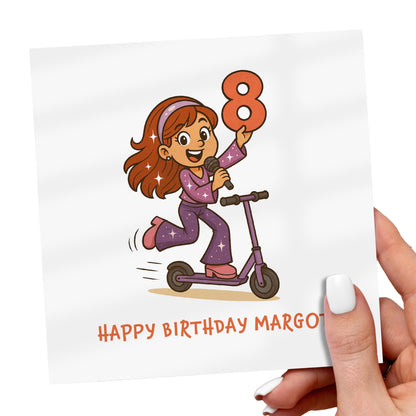 Birthday card with a cartoon girl on a scooter holding the number 8, with 'Happy Birthday Margo' text.
