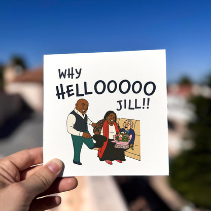 Hand holding a card with cartoon illustration and text 'Why HELLOOOO Jill!!' against a blurred outdoor background.