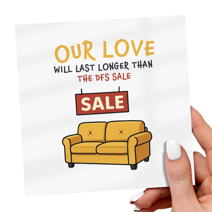 Card with yellow couch and text 'Our love will last longer than the DFS sale' held by a hand.