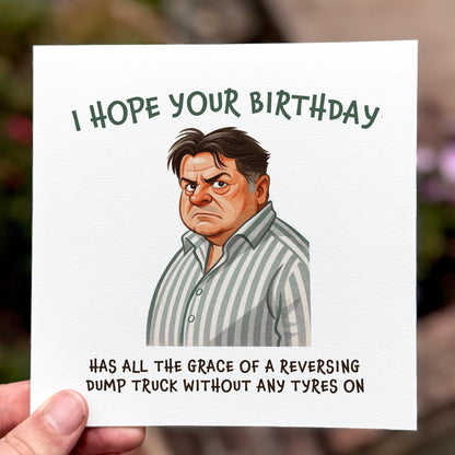 Cartoon character with humorous birthday message on a card