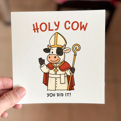 Card with cartoon cow in priest outfit and 'HOLY COW YOU DID IT!' text