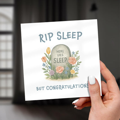 Card with tombstone illustration and humorous text held by a hand.