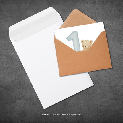 Card with a bear and number one on a brown envelope against a gray background