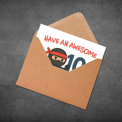 Card with 'Have an Awesome 10' text and a ninja graphic in an open brown envelope on a dark background.