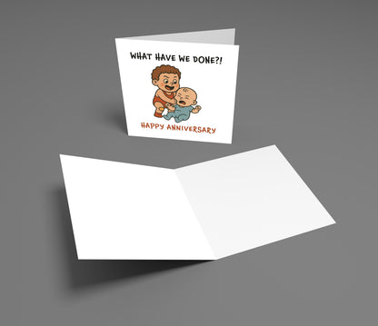 Card with cartoon illustration of a man and baby, text 'What have we done?! Happy Anniversary', on a gray background.