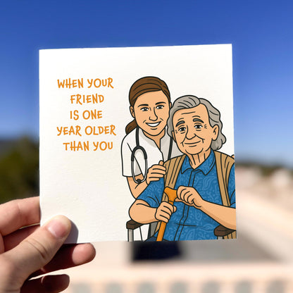 Card with illustration of a young doctor and an elderly person, with text 'When your friend is one year older than you'.