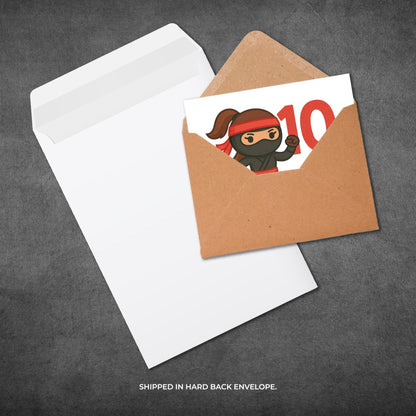 Gift card with a ninja design in a brown envelope on a gray background