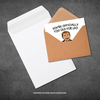 Card with humorous text and illustration in a brown envelope on a gray background