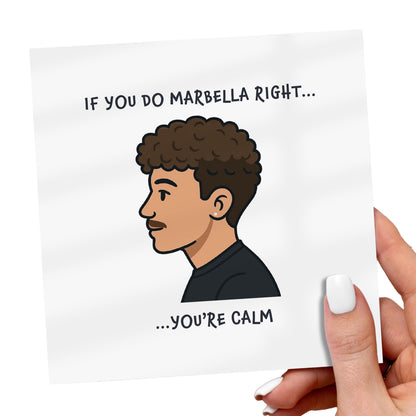 Card with cartoon illustration of a person and humorous text, held by a hand.