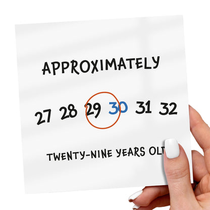 Hand holding a piece of paper with numbers circled, indicating a guess of age.