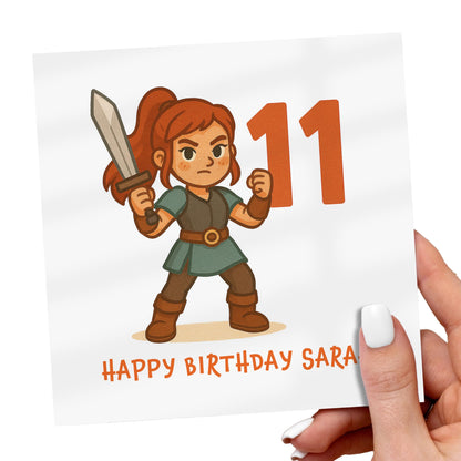 Cartoon character holding a sword with 'Happy Birthday Sara' text on a white card.