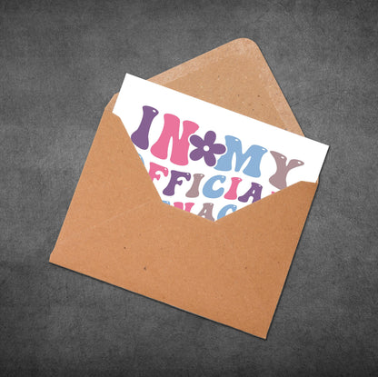 Colorful card with text inside a brown envelope on a dark gray background