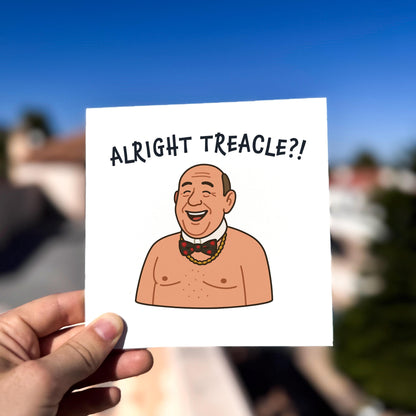 Cartoon character on a card with text 'ALRIGHT TREACLE?!' held against a blurred outdoor background.