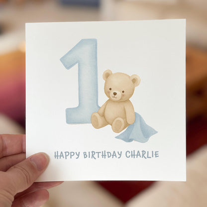 Birthday card with a teddy bear and number '1' on a white background