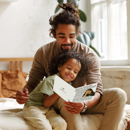 Man and child sitting together reading a book in a cozy room.