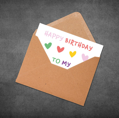 Brown envelope with a birthday card inside on a dark gray background