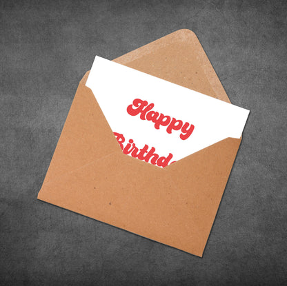 Brown envelope with a white card inside displaying 'Happy Birthday' text on a dark gray background