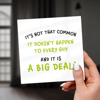 Hand holding a sign with motivational text on a blurred background