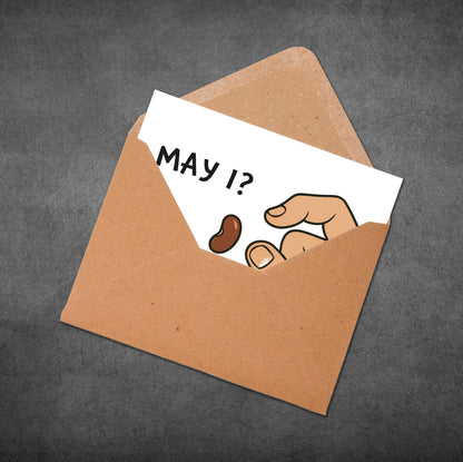 Brown envelope with a white card inside featuring a hand and the text 'May I?'.