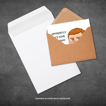 Greeting card with a humorous illustration of a person peeking out, shipped in a brown envelope on a gray background.