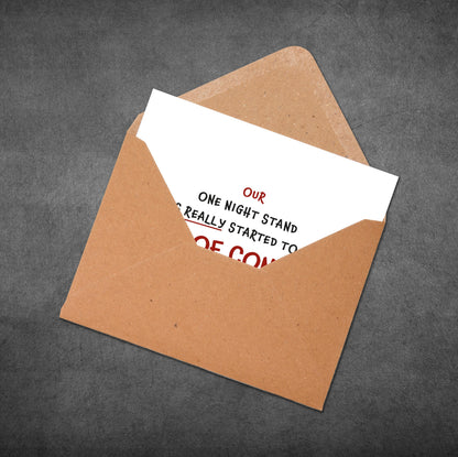 Open brown envelope with a white card inside on a dark gray background