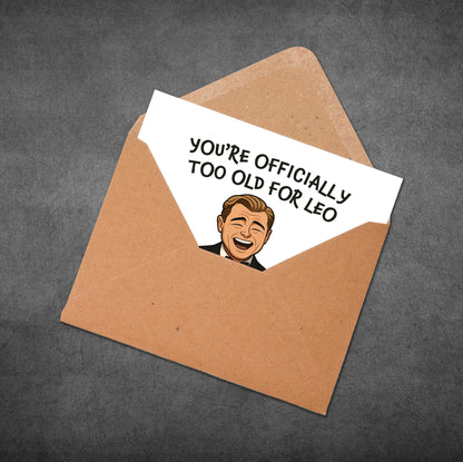 Open brown envelope with a card inside featuring a cartoon of a man and text on a dark gray background