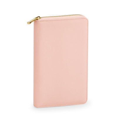 Pink wallet with gold zipper on a white background