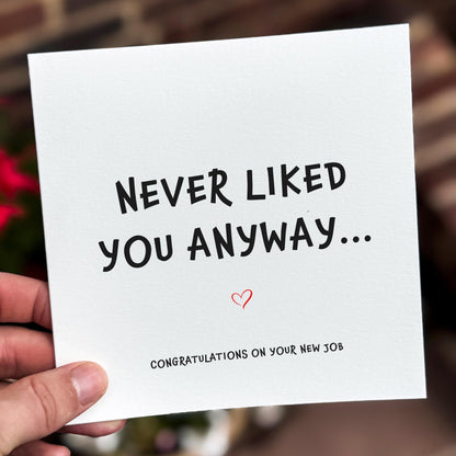 Card with text 'Never liked you anyway... Congratulations on your new job' held by a hand.