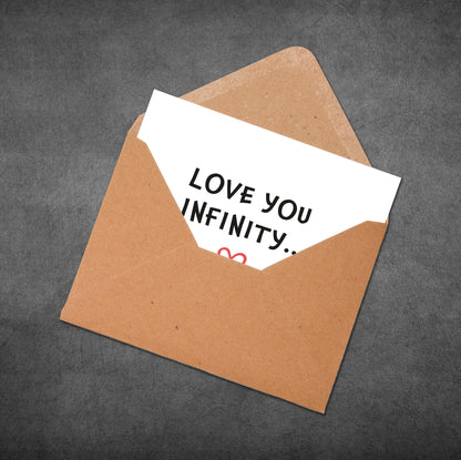 Brown envelope with a white card inside reading 'Love you infinity.' on a dark gray background