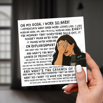 Hand holding a card with text and a cartoon illustration of a woman with her head in her hands.