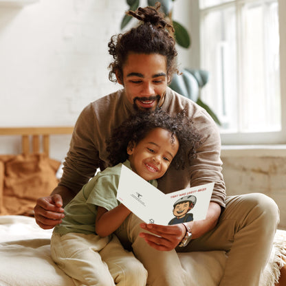 Man and child reading a book together in a cozy room.