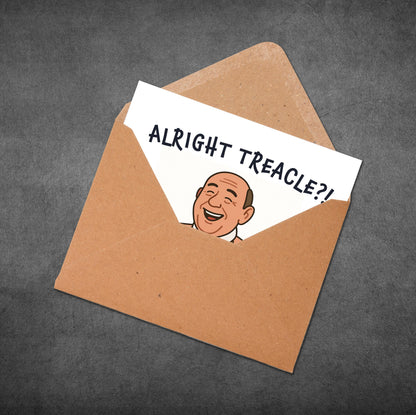 Open brown envelope with a card inside featuring a cartoon face and text on a dark gray background
