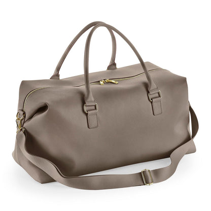 Brown duffel bag with gold zippers on a white background