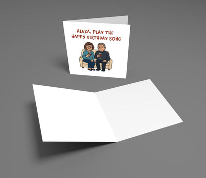 Greeting card with cartoon couple and text 'Alexa, play the happy birthday song' on a gray background