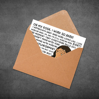 Card with humorous text and illustration in an open brown envelope on a dark background
