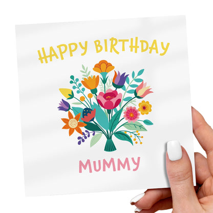 Greeting card with colorful flowers and 'Happy Birthday Mummy' text held by a hand.