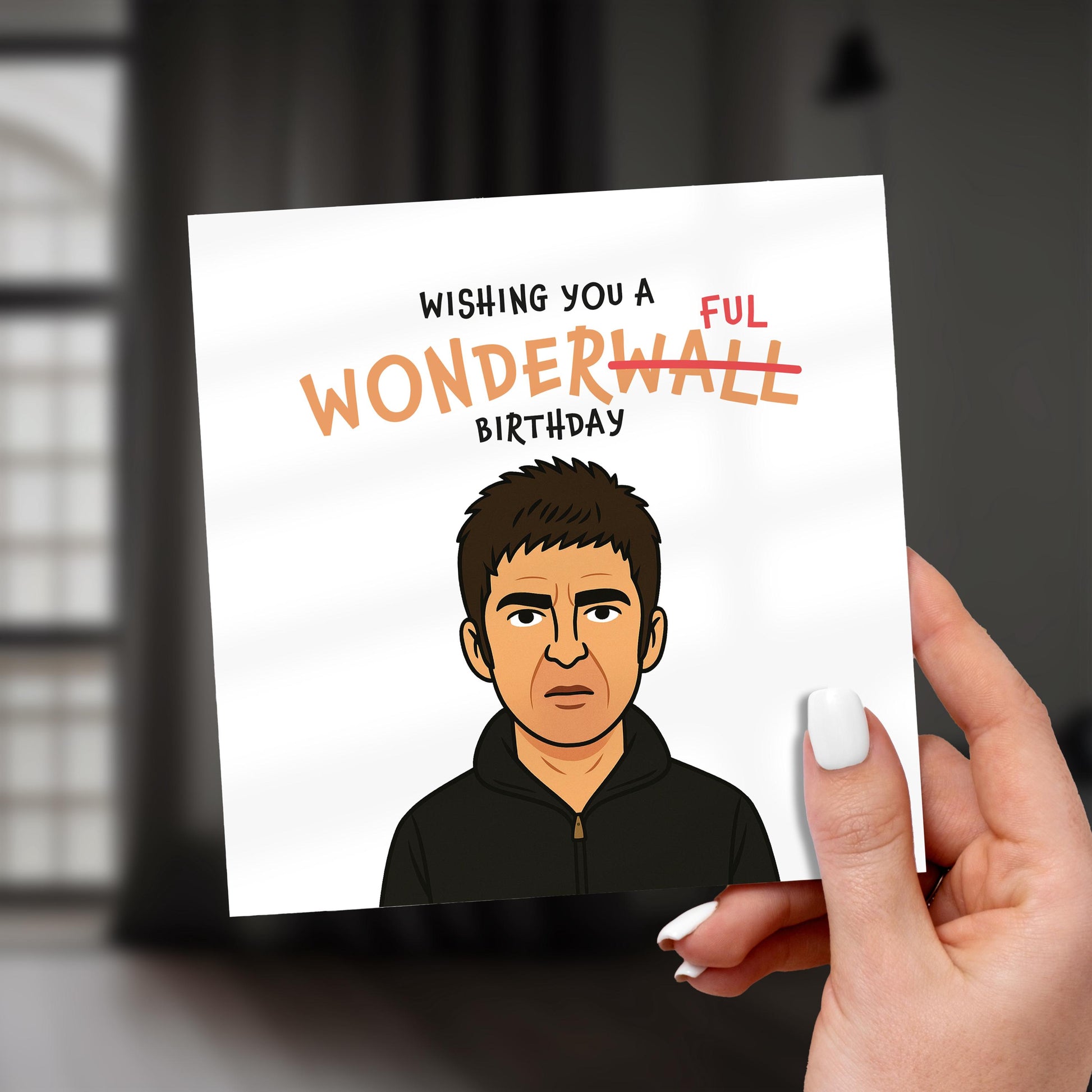 Hand holding a birthday card with a cartoon character and humorous text.