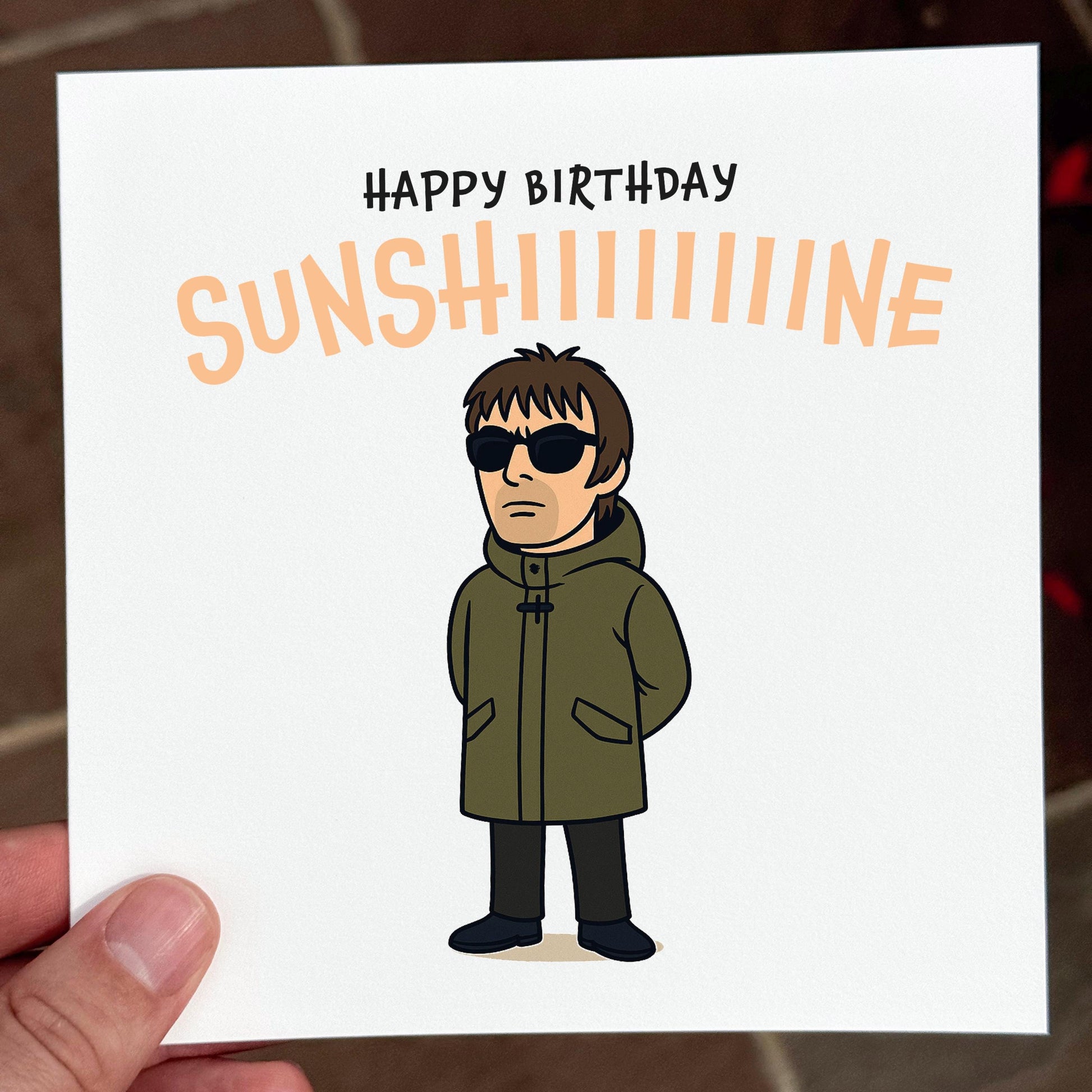 Birthday card with a cartoon character wearing sunglasses and a green coat, with 'Happy Birthday Sunshine' text.