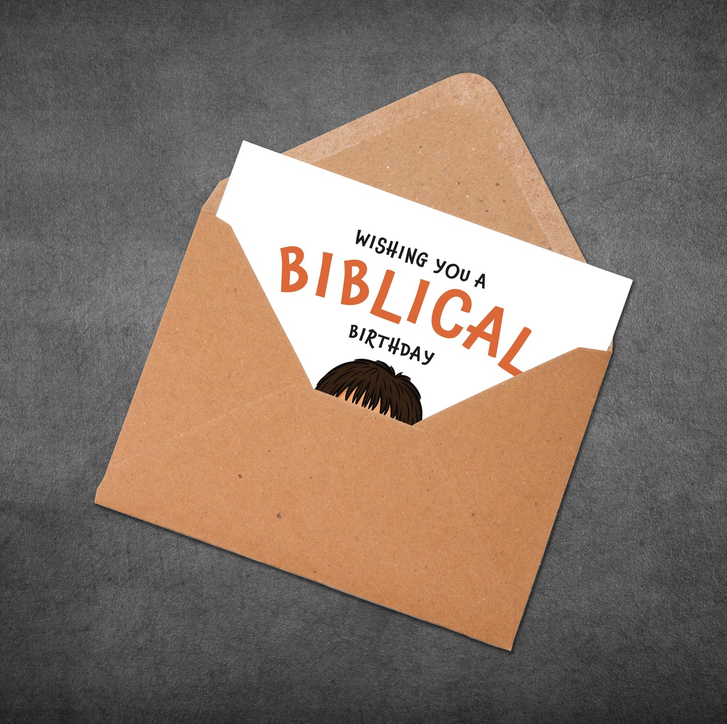 Brown envelope with a white card inside displaying 'Wishing you a Biblical Birthday' text.