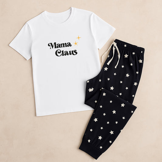 White t-shirt with 'Mama Claus' text and black pants with star patterns on a beige background